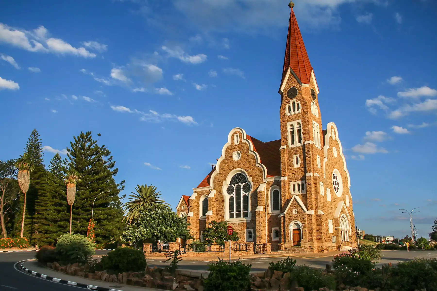Side profile of Christuskirche built with Namibian quartz sandstone, showing the stained glass windows.